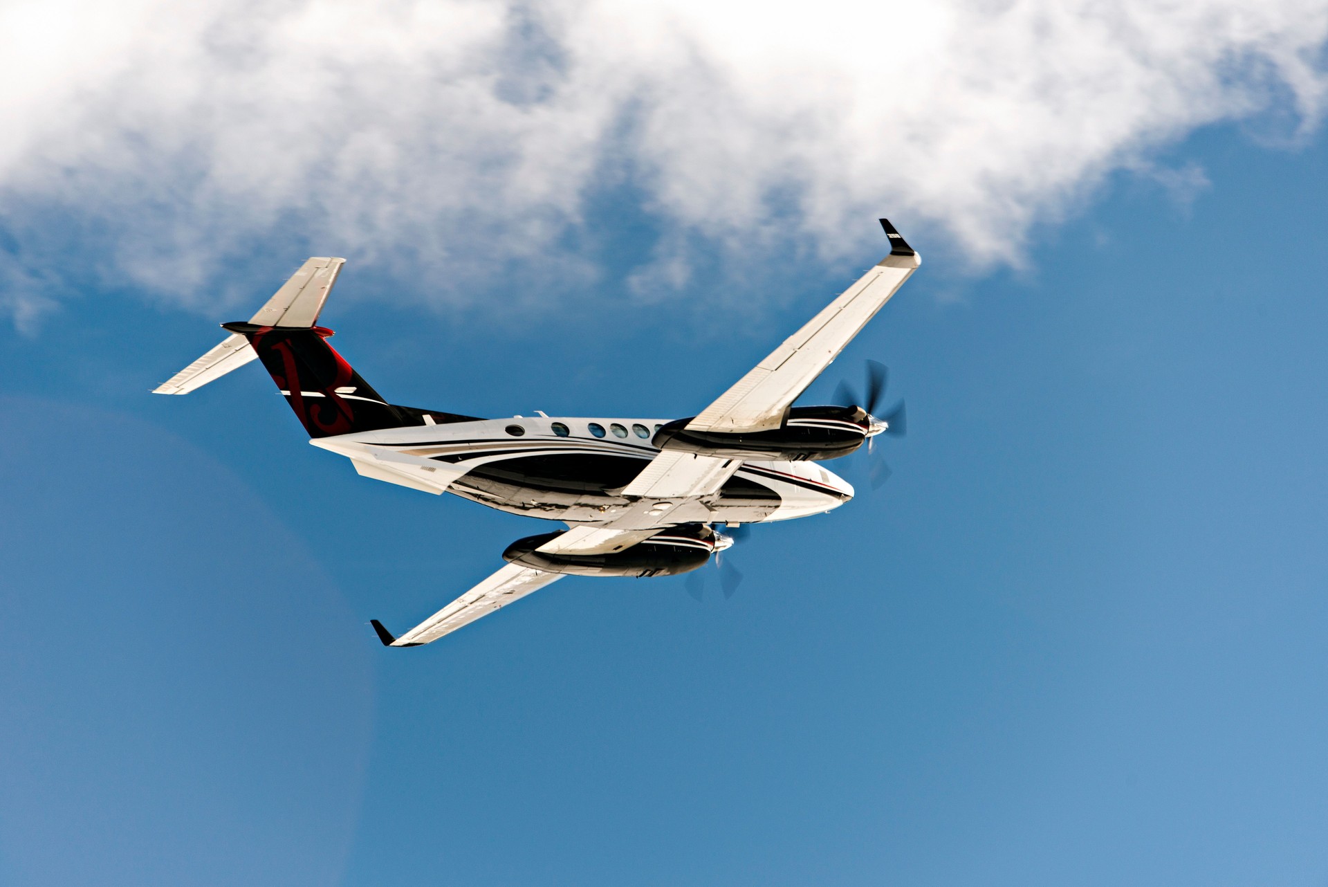 A private jet flying in the blue sky